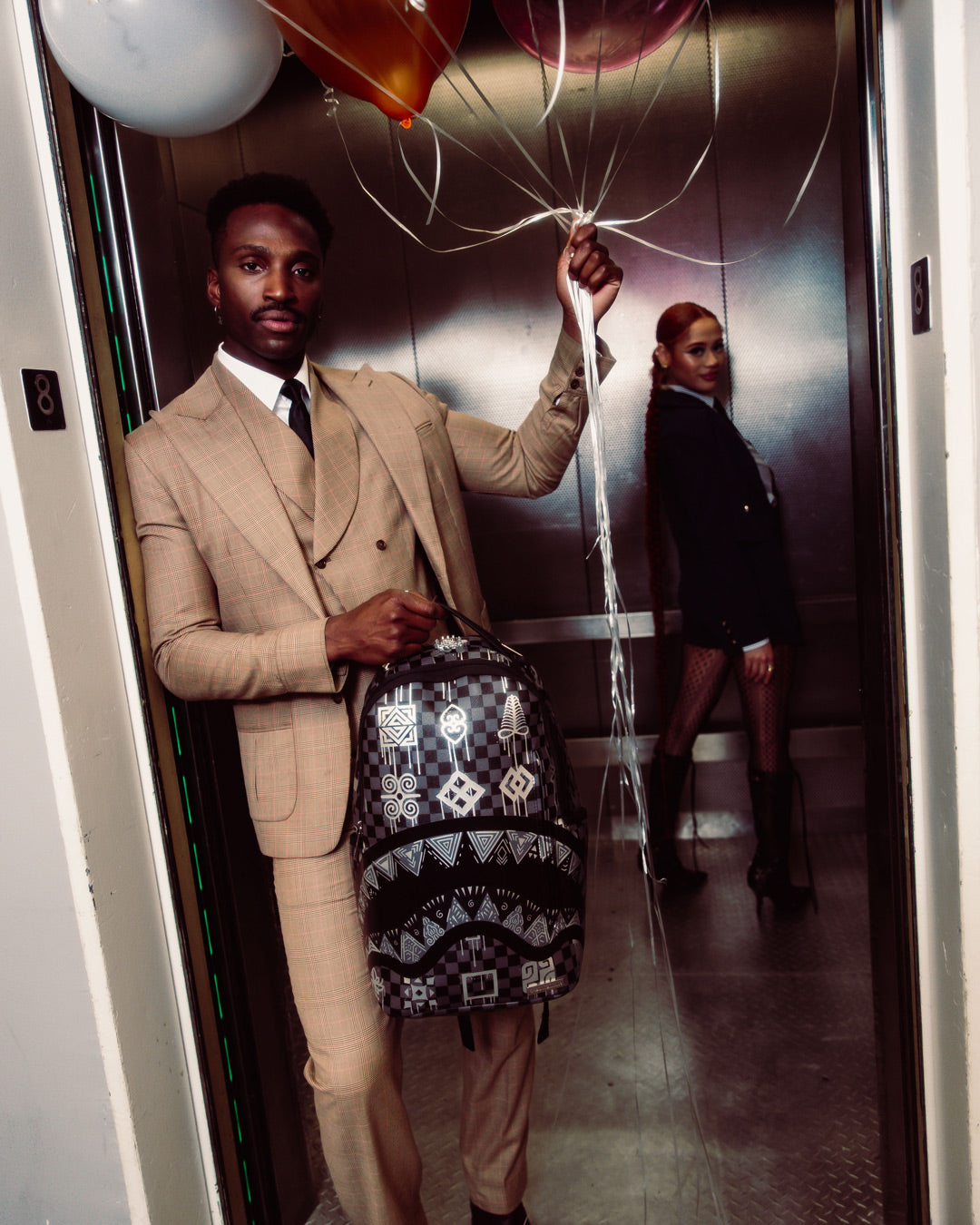 AFRICAN INTELLIGENCE 9 POWER GLYPHICS BACKPACK - SANDFLOWER COLLAB
